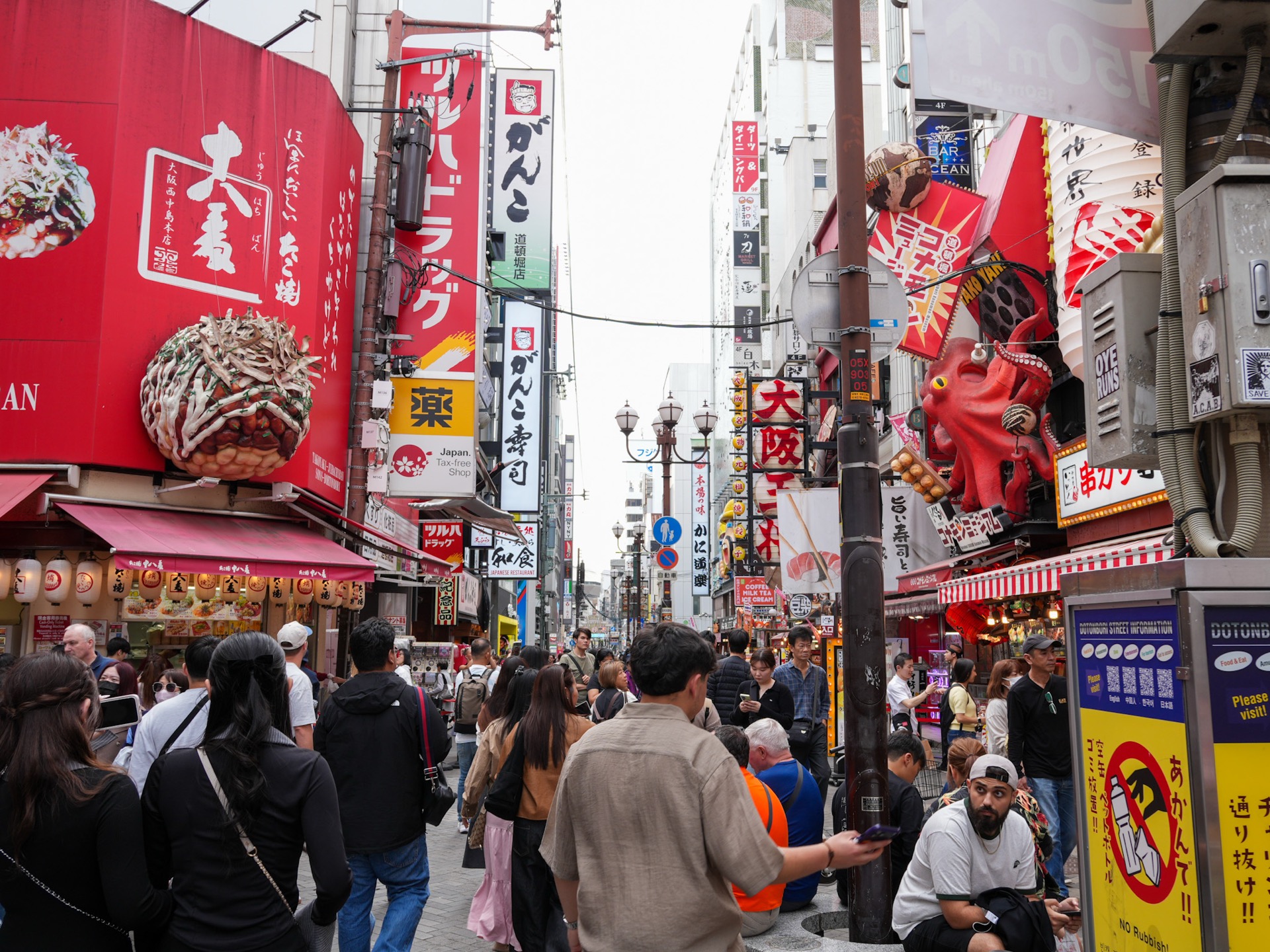 Crowded Dotonbori street with neon signs