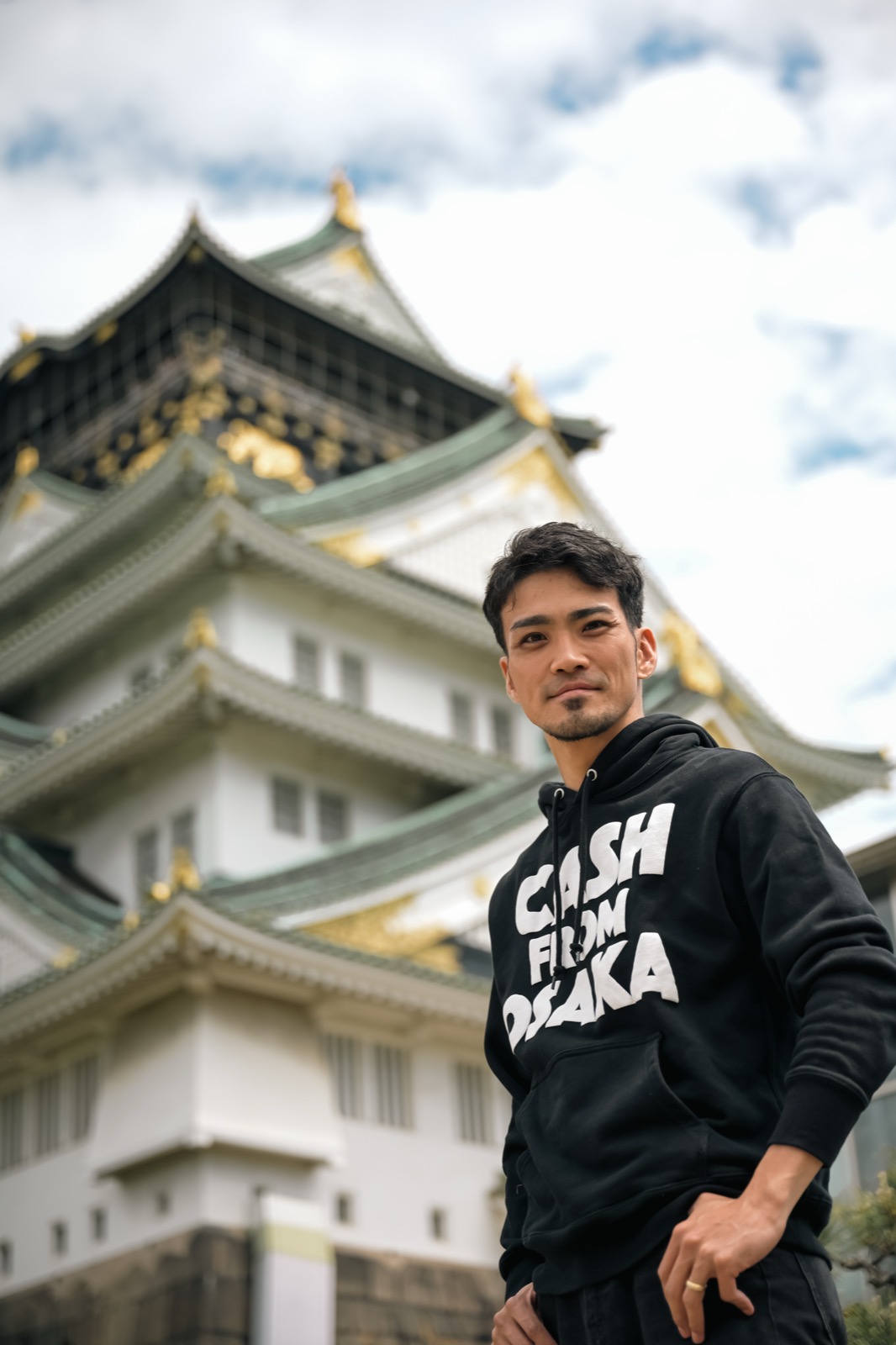 Ryusei, founder and guide of OSS Osaka, in front of Osaka Castle